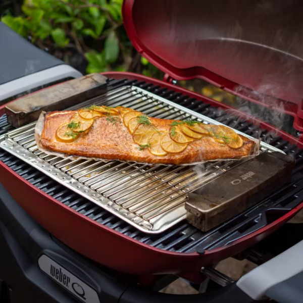 Weber Smoker Box in use while cooking a salmon fillet.